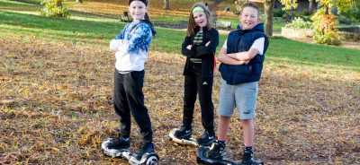 Kids standing on hoverboards